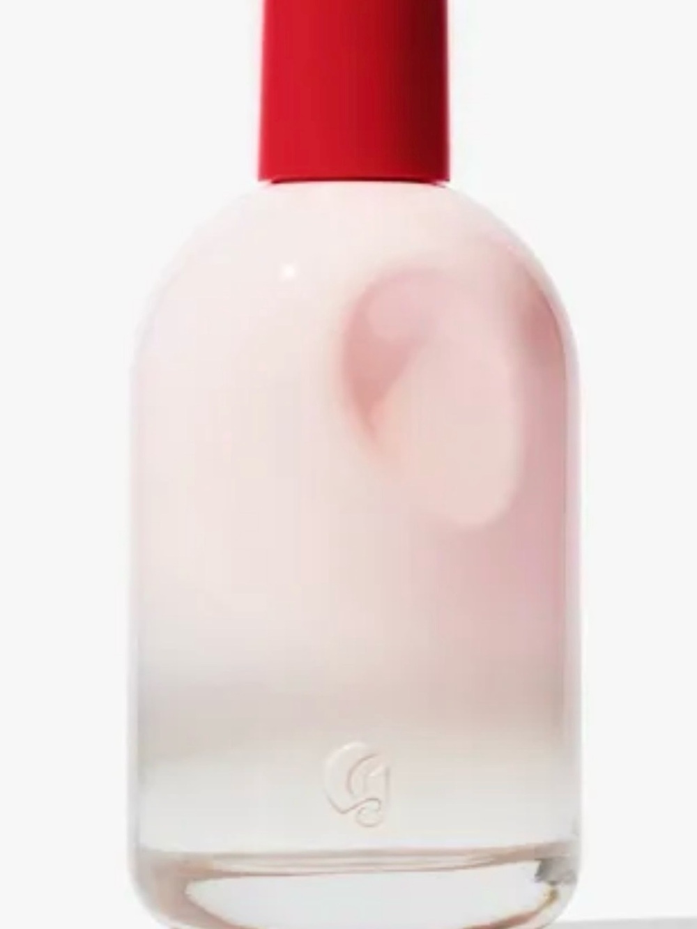 Glossier pale pink lotion bottle with red cap